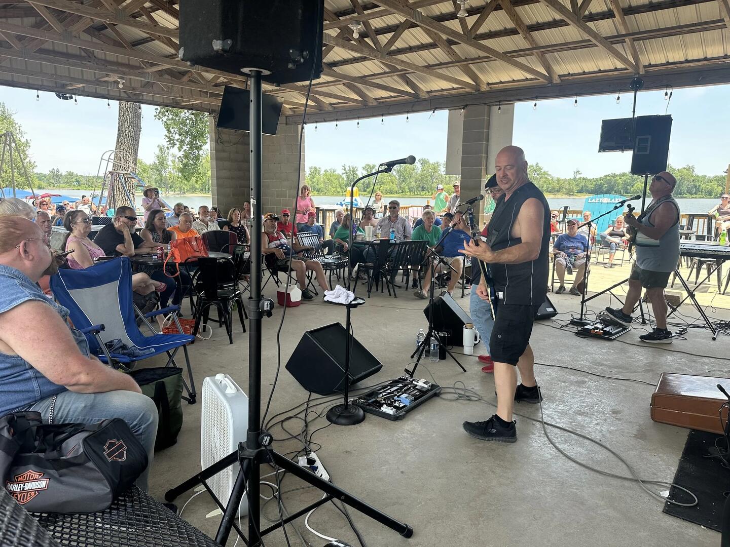 Live band performing lakeside at Lazy L Lake Campground